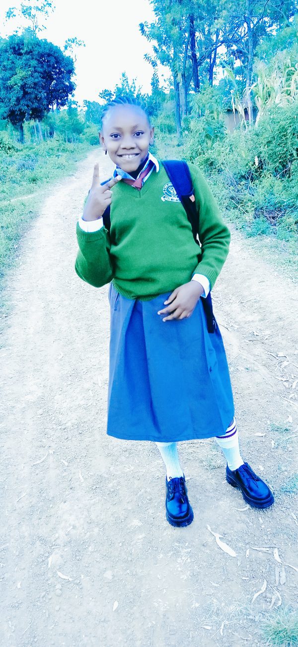 This is my daughter nissi in grade 7 a good Samaritan bought her uniform promised to pay fees but never fulfilled